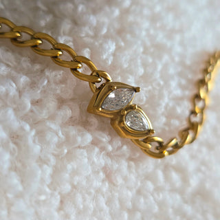 18k gold-plated marquise CZ charm bracelet worn on wrist