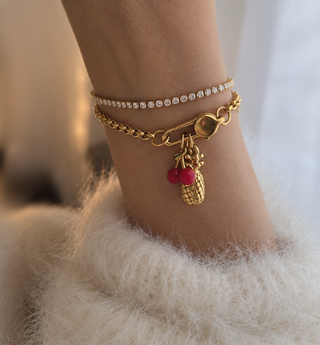 A textured gold pineapple charm designed for charm necklaces, bracelets and personalised jewellery. A fun tropical fruit charm that works beautifully worn alone or mixed with other charms.