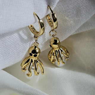 Irregular Ivory baroque pearls dangle drop hoop earrings with octopus charms.intricate detailing of tentacles and pearl