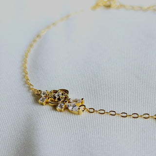 Dainty slim chain rose charm adjustable braceletin 16 carat gold with cubic zirconia gemstones