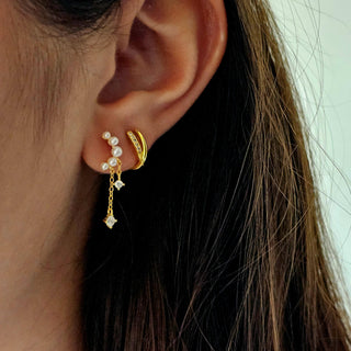 Crescent moon shaped pearl encrustedstud chain drop earringsin 16 carat gold on Sterling silver with dainty chain dangle drops with cubic zirconia charms.