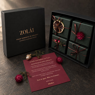 ZOLÁI Four Sundays of Advent box with four wrapped Sunday boxes and a burgundy note card