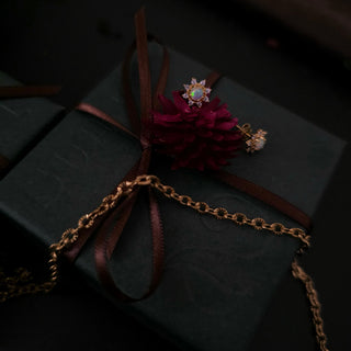 Opal studs and gold chain on a ZOLÁI Advent Sunday box